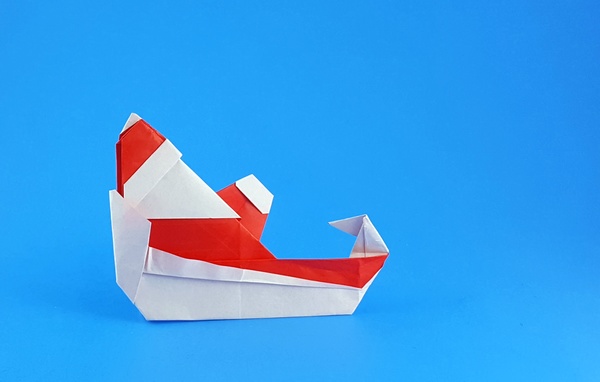 Origami Santa Claus in sleigh by Francesco Miglionico folded by Gilad Aharoni