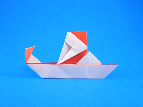 Origami Santa on sled by Niwa Taiko folded by Gilad Aharoni