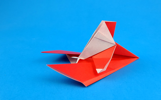 Origami Santa on skis by Aoyagi Shoko folded by Gilad Aharoni
