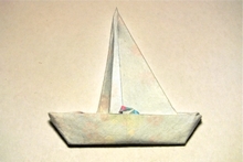 Origami Man in a boat by Robert Harbin on giladorigami.com