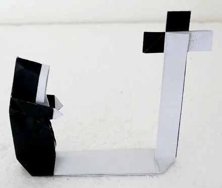 Origami Nun with cross by Fred Rohm on giladorigami.com