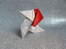Origami Pajarita with Christmas cap by Juan Pedro Rubio Pena on giladorigami.com