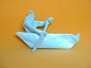 Origami Indian paddling a canoe by Robert J. Lang on giladorigami.com