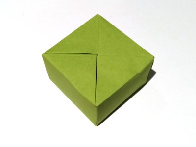 Origami Christmas present by John Montroll on giladorigami.com