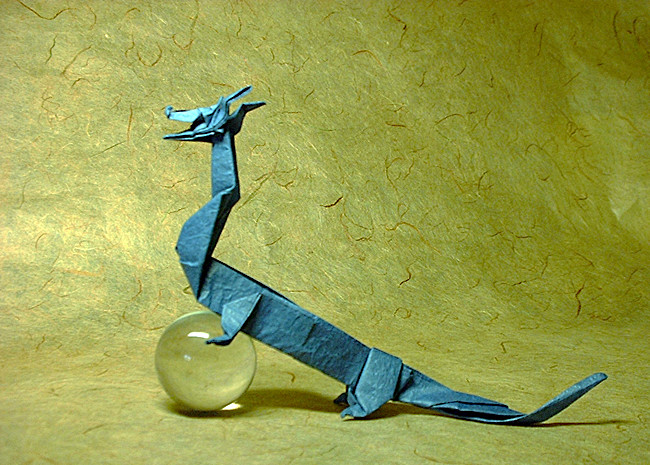 Origami Dragon - Chinese by John Montroll. Folded from a square of Vietnamese wrapping-paper by Gilad Aharoni on giladorigami.com
