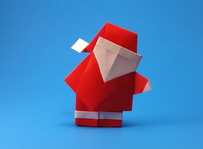 Origami Santa Claus with large hat by Hideo Komatsu. Folded from 2 squares of origami paper by Gilad Aharoni on giladorigami.com
