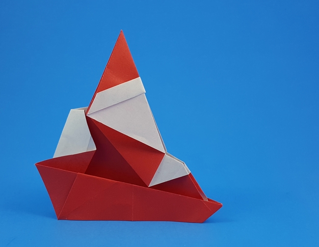 Origami Santa Claus riding on a sled by Katsushi Nosho folded by Gilad Aharoni