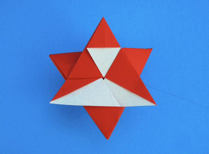 Origami Santa Claus star by Fumiaki Shingu. Folded from a square of origami paper by Gilad Aharoni on giladorigami.com