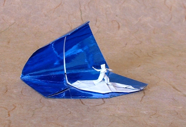Origami Surfer on a wave by Jeremy Shafer. Folded by Gilad Aharoni on giladorigami.com