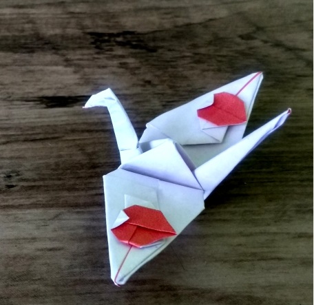 Origami Crane with hearts on wings by Hadi Tahir on giladorigami.com